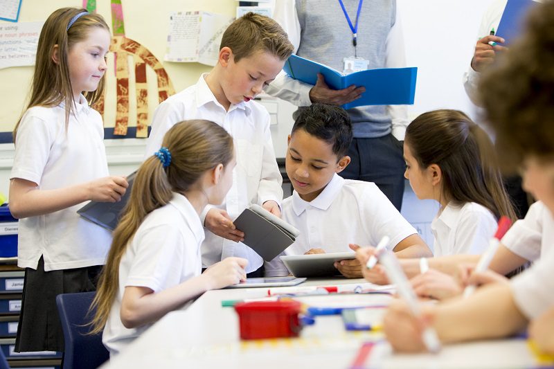 Students working together in a classroom.